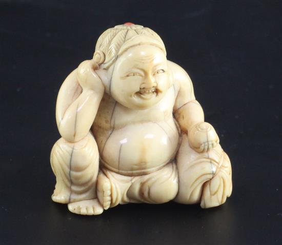 A Japanese ivory seated figure of Hotei, 18th / 19th century, height 3.2cm